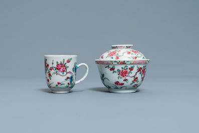 A Chinese famille rose covered bowl, a cup and two saucers with landscape design, Yongzheng