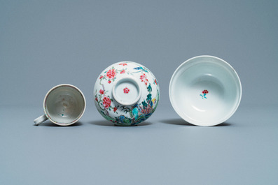 A Chinese famille rose covered bowl, a cup and two saucers with landscape design, Yongzheng