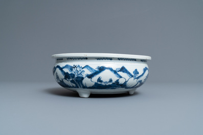 A Chinese blue and white tripod censer with figures in a mountainous landscape, Kangxi