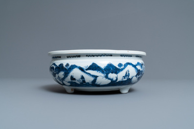 A Chinese blue and white tripod censer with figures in a mountainous landscape, Kangxi