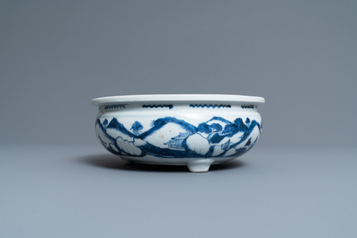 A Chinese blue and white tripod censer with figures in a mountainous landscape, Kangxi