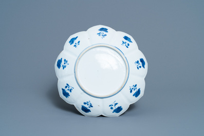 A pair of Chinese blue and white vases, a 'lotus' dish and four cups, Kangxi