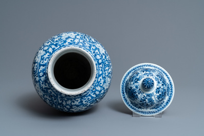 A Chinese blue and white vase and cover with floral design, Kangxi