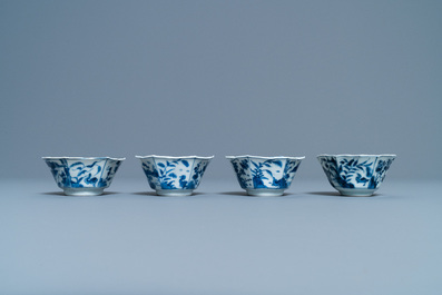 A pair of Chinese blue and white vases, a 'lotus' dish and four cups, Kangxi
