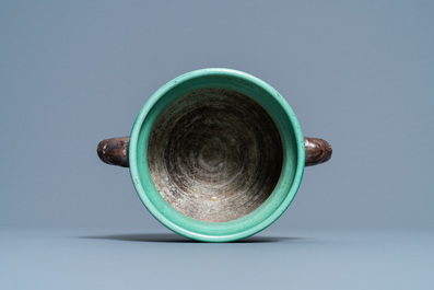 A Chinese verte biscuit 'flaming horses' censer, Jiajing mark, 18/19th C.