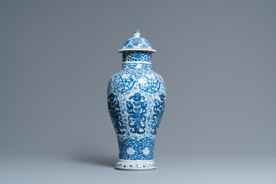 A Chinese blue and white vase and cover with floral design, Kangxi