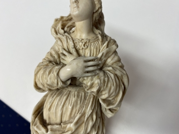 An ivory figure of a Madonna on wooden stand, Flanders or Germany, 17th C.