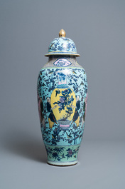 A very large Chinese famille rose turquoise-ground vase and cover, 19th C.