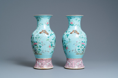 A pair of Chinese famille rose turquoise-ground vases with butterfly handles, 19th C.