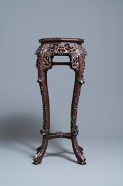 Two reticulated Chinese carved wooden stands, 19/20th C.