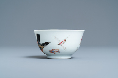 A Chinese famille rose 'bird and insects' cup and saucer, Yongzheng