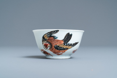 A Chinese famille rose 'bird and insects' cup and saucer, Yongzheng