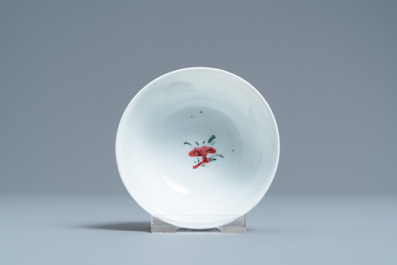 A Chinese famille rose 'bird and insects' cup and saucer, Yongzheng