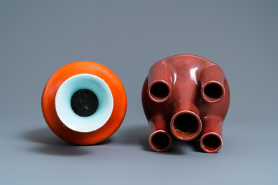 A Chinese monochrome coral red vase and a five-spouted sang de boeuf-glazed vase, 19/20th C.