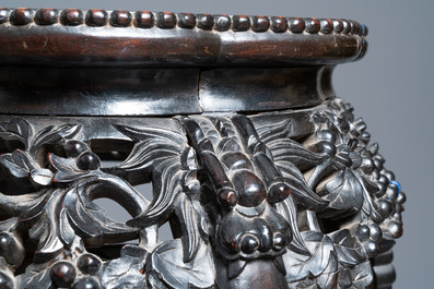 Two reticulated Chinese carved wooden stands, 19/20th C.