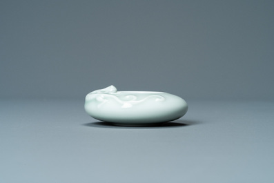 A Chinese celadon-glazed 'dragon' brush washer, Qianlong mark, 19/20th C.