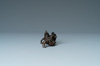 A rare Chinese bronze 'dragon' brush rest, Yuan/Ming
