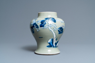 A Chinese blue, white and copper-red celadon-ground 'birds and deer' vase, Kangxi