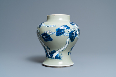 A Chinese blue, white and copper-red celadon-ground 'birds and deer' vase, Kangxi