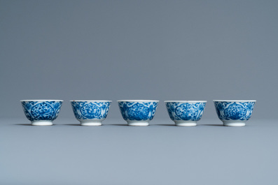 Five Chinese blue and white cups and saucers, Kangxi