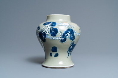 A Chinese blue, white and copper-red celadon-ground 'birds and deer' vase, Kangxi