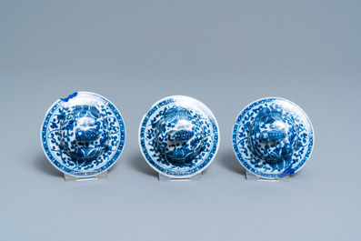 A Chinese blue and white five-piece garniture with floral design, 19th C.