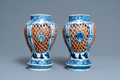 A pair of Japanese Arita blue and white reticulated vases, Edo, 17/18th C.