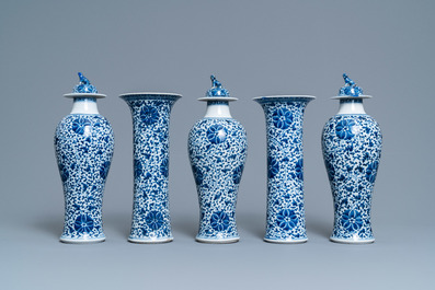 A Chinese blue and white five-piece garniture with floral design, 19th C.
