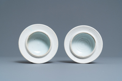 A pair of Chinese blue and white 'peony scroll' vases and covers, Kangxi