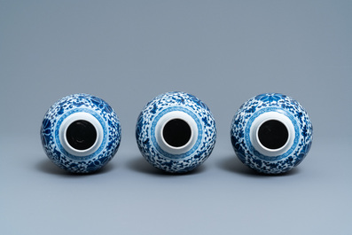 A Chinese blue and white five-piece garniture with floral design, 19th C.