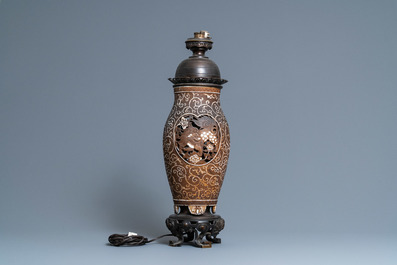 Un vase en biscuit ajour&eacute; &agrave; d&eacute;cor de lions bouddhistes mont&eacute; en lampe, Chine, 19&egrave;me