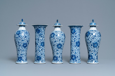 A Chinese blue and white five-piece garniture with floral design, 19th C.