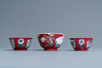 Three Chinese famille rose ruby-ground cups and saucers, Yongzheng