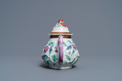 A Chinese famille rose relief-decorated teapot on stand, Yongzheng
