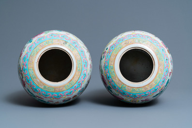 A pair of Chinese famille rose 'antiquities' jars and covers, 19th C.