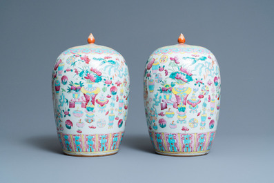 A pair of Chinese famille rose 'antiquities' jars and covers, 19th C.