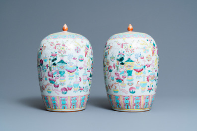 A pair of Chinese famille rose 'antiquities' jars and covers, 19th C.