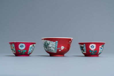 Three Chinese famille rose ruby-ground cups and saucers, Yongzheng