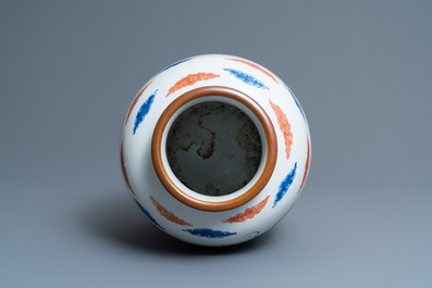 A Chinese wucai 'dragon and phoenix' vase, 19th C.