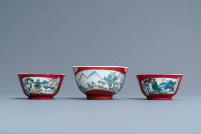 Three Chinese famille rose ruby-ground cups and saucers, Yongzheng