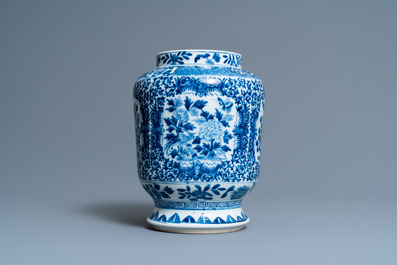 A Chinese blue and white 'birds and butterflies' vase, seal mark, 19th C.