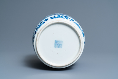 A Chinese blue and white 'birds and butterflies' vase, seal mark, 19th C.