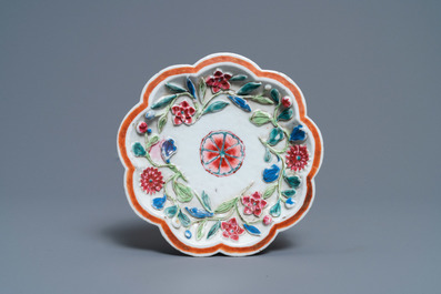 A Chinese famille rose relief-decorated teapot on stand, Yongzheng