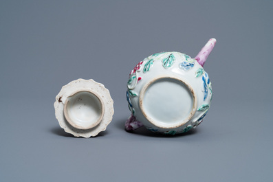 A Chinese famille rose relief-decorated teapot on stand, Yongzheng