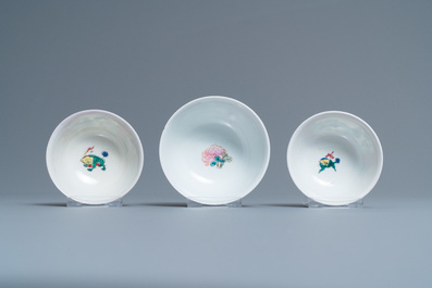 Three Chinese famille rose ruby-ground cups and saucers, Yongzheng