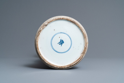 Een Chinese blauw-witte 'gu' vaas met florale en landschapspanelen, Kangxi