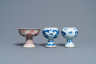 A pair of Chinese blue and white 'dragon' stem cups and one in copper-red, 19/20th C.