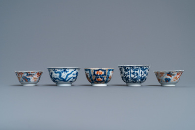 Five various Chinese cups and saucers and a small dish, Kangxi/Qianlong