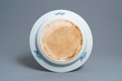 A large deep Chinese blue and white dish with a lady, Qianlong