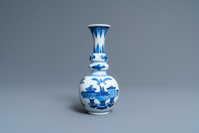 A Chinese blue and white triple gourd 'antiquities' vase, Kangxi